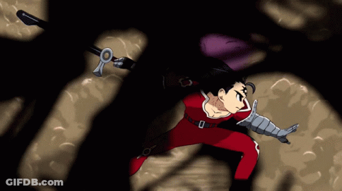 A Man In A Red Suit Is Holding A Sword In His Right Hand GIF