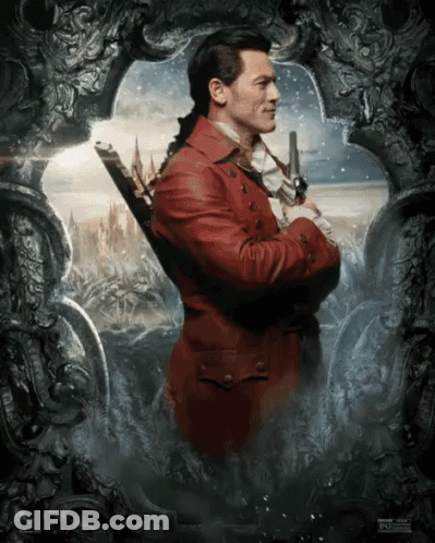 A Man In A Red Suit Is Holding A Sword GIF