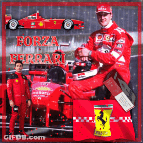 A Man In A Red Suit Is Sitting In Front Of A Ferrari GIF