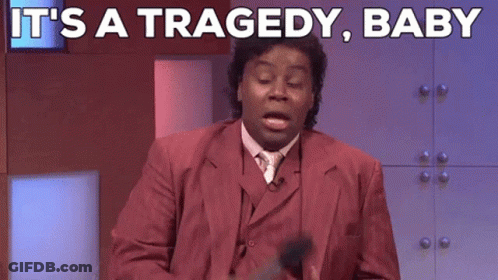 A Man In A Red Suit Says It 'S A Tragedy Baby While Holding A Microphone GIF