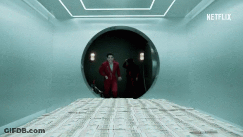 A Man In A Red Suit Stands In A Room With A Stack Of Money On The Floor And A Netflix Logo GIF