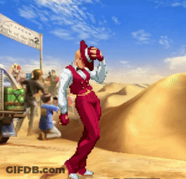 A Man In A Red Suit Stands In Front Of A Sign That Says Mark Of The King 2 GIF