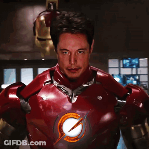 A Man In A Red Suit With A Lightning Bolt On The Chest GIF