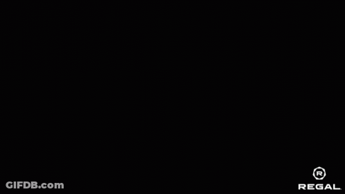 Man In Red Superhero Costume Standing In Doorway GIF