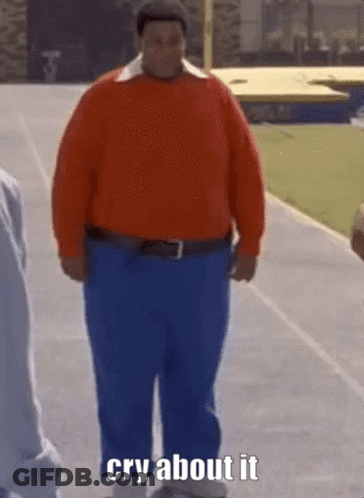A Man In A Red Sweater And Blue Pants Is Walking Down A Track And Says Cry About It . GIF