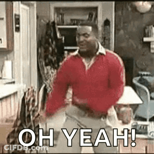A Man In A Red Sweater Is Dancing In A Living Room And Saying Oh Yeah . GIF