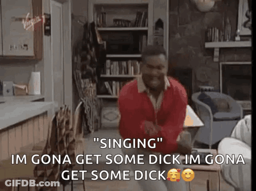 A Man In A Red Sweater Is Singing In A Living Room .. GIF