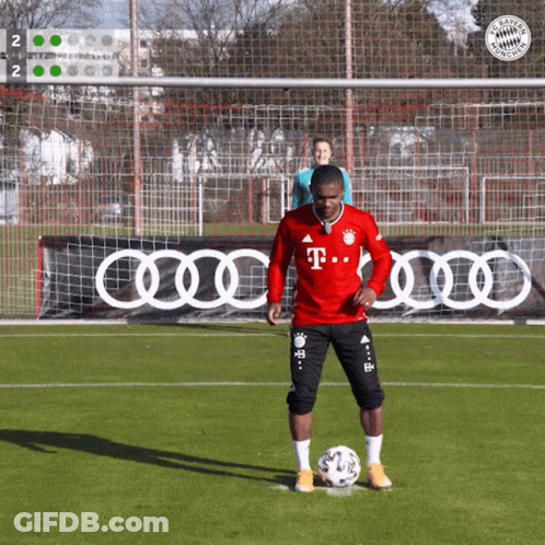 A Man In A Red T-Mobile Jersey Kicking A Soccer Ball GIF