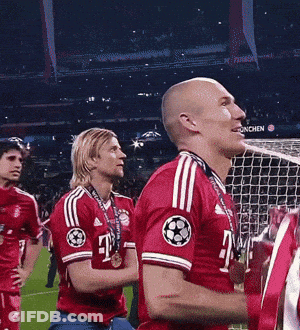 A Man In A Red T-Mobile Jersey Stands Next To Another Man GIF