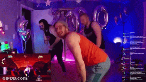 A Man In A Red Tank Top Is Dancing In Front Of A Screen That Says Just Dance On It GIF