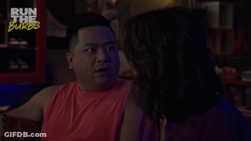 A Man In A Red Tank Top Is Talking To A Woman With The Words Freaky Streak Above Him GIF