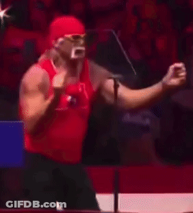 A Man In A Red Tank Top Stands In Front Of A Sign That Says Aga On It GIF