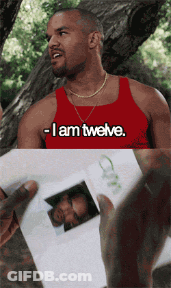 A Man In A Red Tank Top That Says I Am Twelve GIF