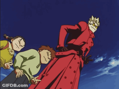 A Man In A Red Trench Coat Is Pointing At Something GIF