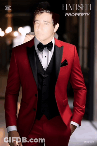 A Man In A Red Tuxedo With Hansen Property On The Bottom GIF