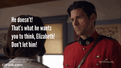 A Man In A Red Uniform Is Talking To A Woman In A Hallmark Ad GIF