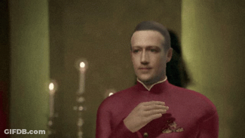A Man In A Red Uniform Is Waving His Hand In Front Of A Woman GIF