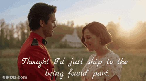 A Man In A Red Uniform Looks At A Woman In A White Dress GIF