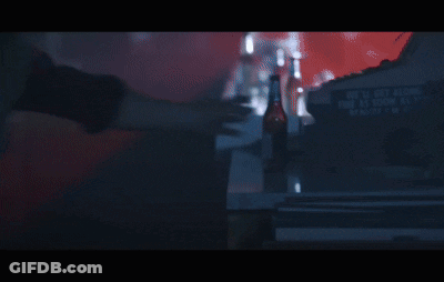 A Man In A Red Varsity Jacket Has The Letter S On His Chest GIF