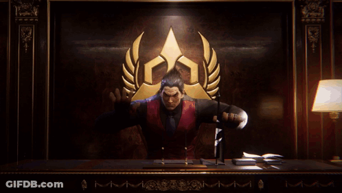 A Man In A Red Vest And Black Shirt Is Standing In Front Of A Gold Laurel Wreath GIF