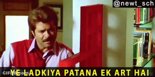 A Man In A Red Vest Is Standing In Front Of A Red Door With A Caption That Says Ye Ladkiya GIF