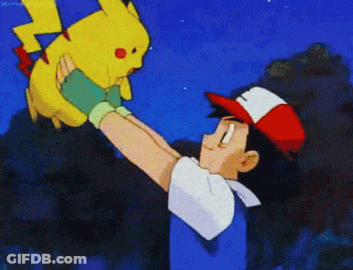 A Man In A Red White And Blue Hat Is Holding A Yellow Pikachu GIF