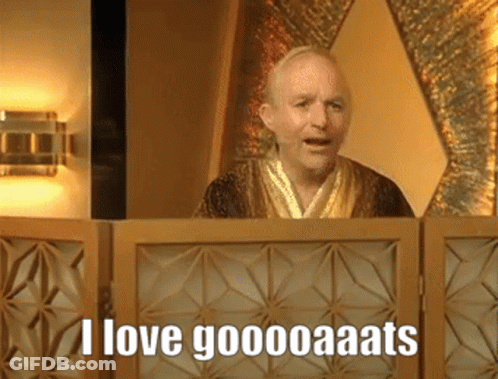 A Man In A Robe Behind A Wooden Screen Says I Love Goooooaats GIF