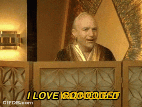 A Man In A Robe Is Behind A Screen That Says I Love Roomquest GIF