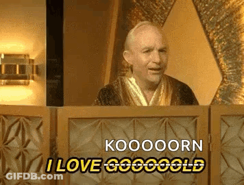A Man In A Robe Is Standing Behind A Podium And Saying Koooooorn I Love Gogoold GIF