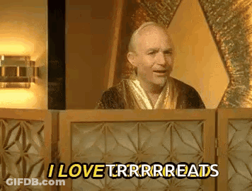 A Man In A Robe Is Standing In Front Of A Wooden Fence And Saying `` I Love Trrrreads '' . GIF