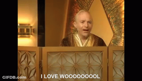A Man In A Robe Is Standing In Front Of A Wooden Screen And Says `` I Love Woooooool '' . GIF