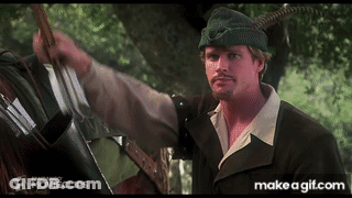 A Man In A Robin Hood Outfit Is Holding A Bow And Arrow GIF