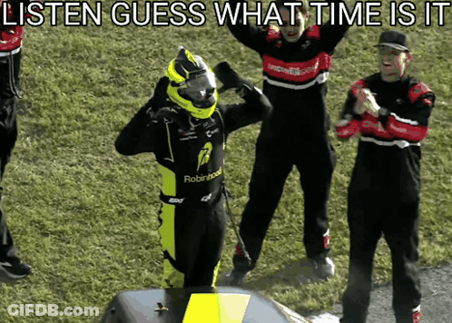 A Man In A Robinhood Racing Suit Stands On A Podium GIF