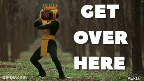 A Man In A Robot Costume Is Dancing In The Woods With The Words Get Over Here Below Him GIF