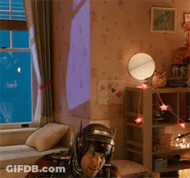 Man In Robot Costume Sitting In Room GIF