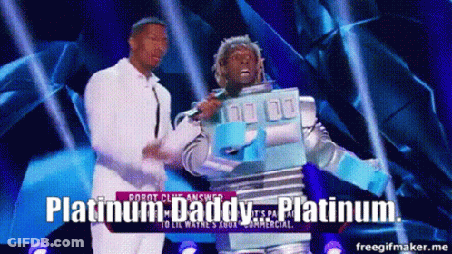 A Man In A Robot Costume Is Standing Next To A Man In A White Shirt And Says Platinum Daddy GIF