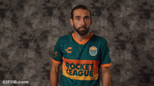 A Man In A Rocket League Jersey Holds A Red Card In Front Of His Face GIF