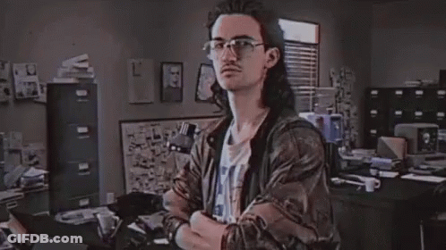 A Man In A Room With The Word Hackerman On The Screen GIF