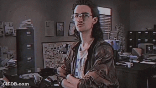 A Man In A Room With The Word Hackerman On The Screen GIF