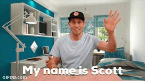A Man In A Room With The Words " My Name Is Scott " Behind Him GIF