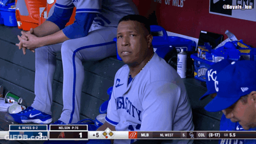 A Man In A Royals Jersey Sits In The Dugout Watching A Baseball Game GIF