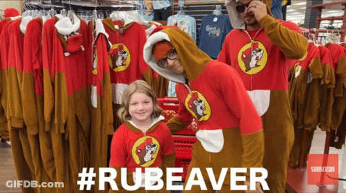 A Man In A Rubeaver Costume Poses With A Little Girl GIF