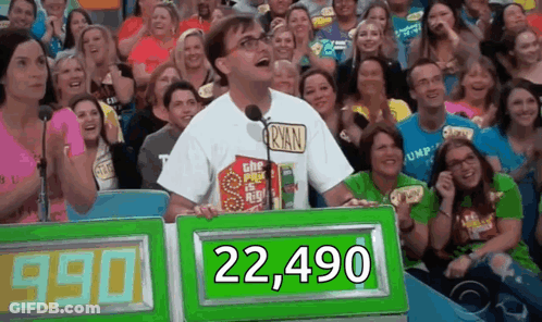 A Man In A Ryan Shirt Is Standing In Front Of A Crowd Of People GIF