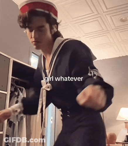 A Man In A Sailor Outfit Is Dancing With The Words Girl Whatever Above Him GIF