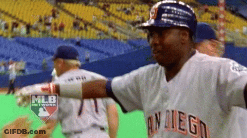 A Man In A San Diego Baseball Uniform Is Standing On A Baseball Field GIF