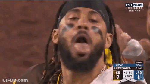 A Man In A San Diego Jersey Stands In The Dugout During A Baseball Game GIF