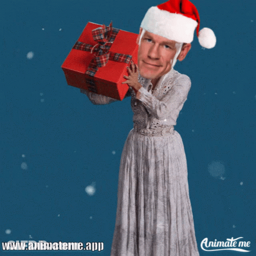 A Man In A Santa Hat Is Holding A Red Gift GIF
