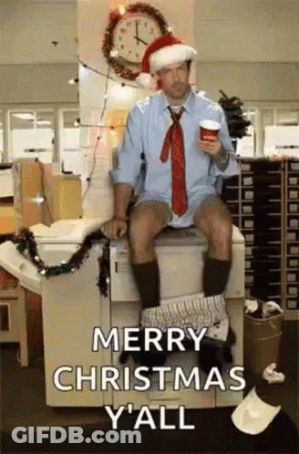 A Man In A Santa Hat Is Sitting On A Toilet GIF