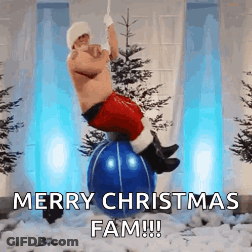 A Man In A Santa Suit Is Balancing On A Blue Christmas Ball GIF