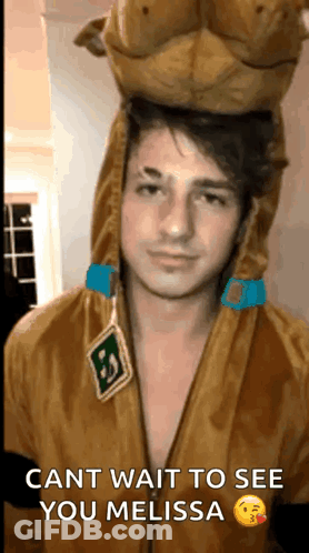 A Man In A Scooby Doo Costume Is Waiting To See His Girlfriend . GIF